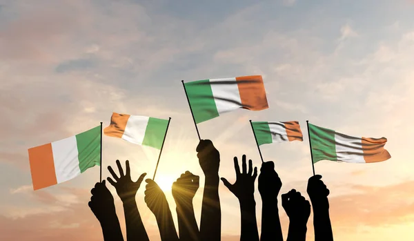 Silhouette of arms raised waving an Ireland flag with pride. 3D Rendering — Stock Photo, Image