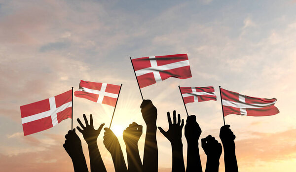 Silhouette of arms raised waving a Denmark flag with pride. 3D Rendering