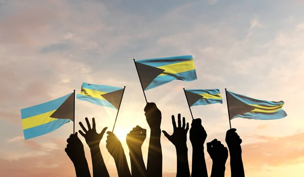 Silhouette di braccia alzate sventolando una bandiera delle Bahamas con orgoglio. Rendering 3D — Foto Stock