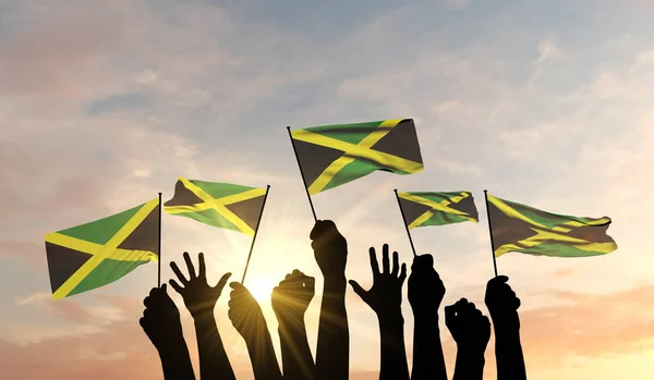 Silhouette of arms raised waving a Jamaica flag with pride. 3D Rendering — Stock Photo, Image