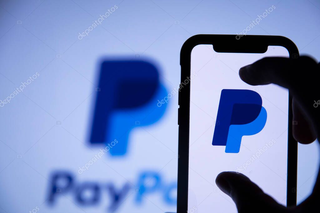LONDON, UK - August 2021: Paypal finance service logo on a smartphone.