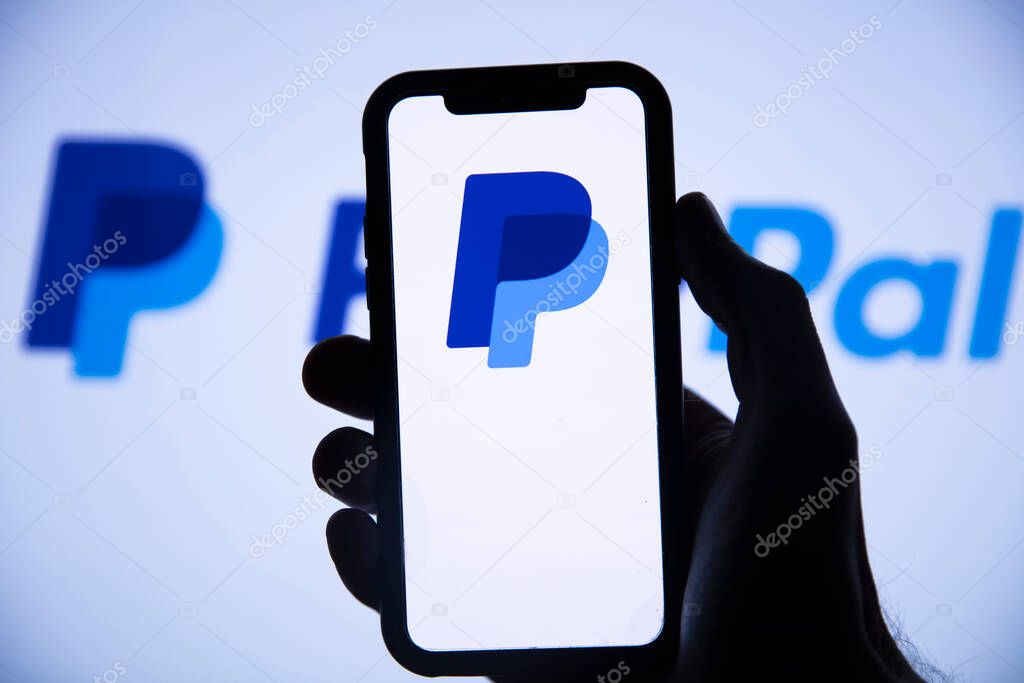 LONDON, UK - August 2021: Paypal finance service logo on a smartphone.