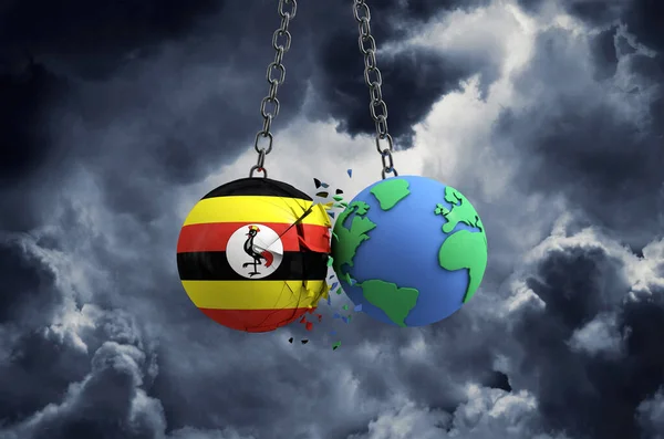 Sfera di bandiera dell'Uganda che si schianta sul pianeta terra. Impatto globale e concetto di disastro. Render 3D — Foto Stock
