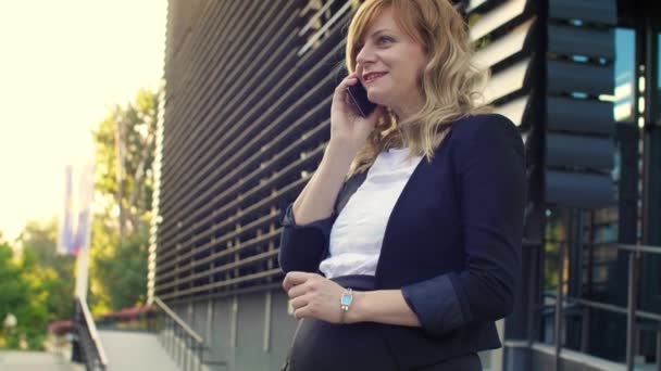 Smiling Pregnant Businesswoman Standing Front Modern Building While Talking Her — Stock Video