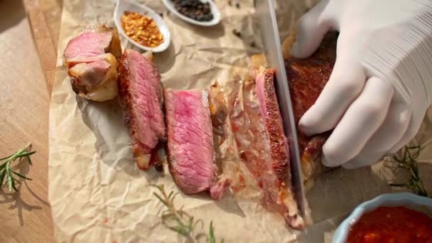 Close View Chef Holding Cutting Grilled Steak Thinner Pieces Wooden — Stock Video