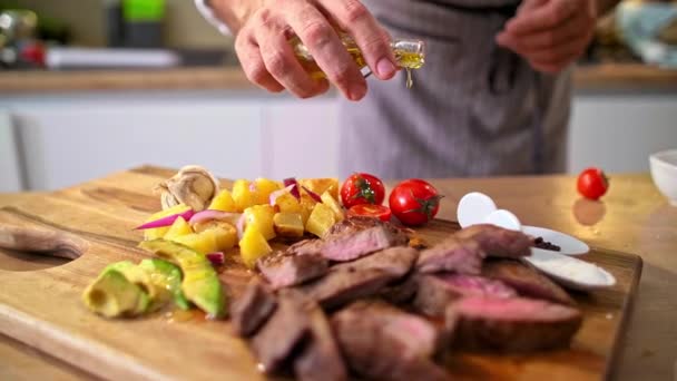 Close Chef Adding Olive Oil Roasted Meat Wooden Kitchen Board — Stock Video