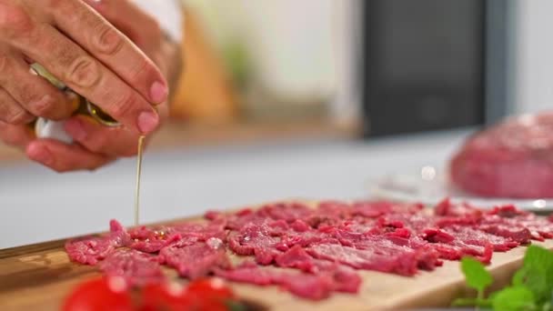 Close Chef Hands Adding Olive Oil Carpaccio Meat Wooden Kitchen — Stock Video