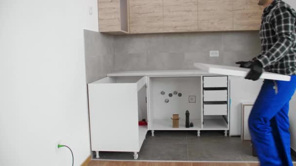 Carpenter Puts Kitchen Working Surface Place Almost Finished Kitchen Hanging — Stock Video