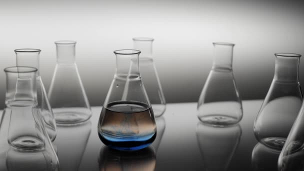 Blue Liquid Spills Water Laboratory Flask — Stock Video
