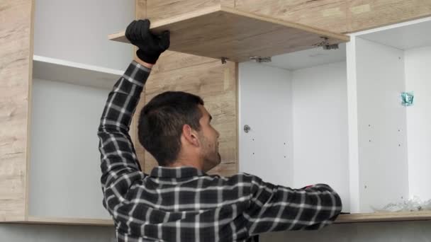 Carpenter Sets Screws Mechanisms Joints Kitchen Shelf Door — Stock Video