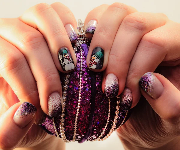 Nails lacquered in fun Christmas style. — Stock Photo, Image