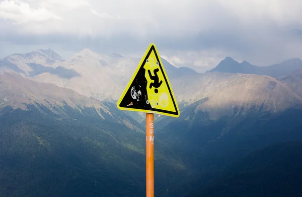 A sign in the mountains. Dangerous. — Stock Photo, Image