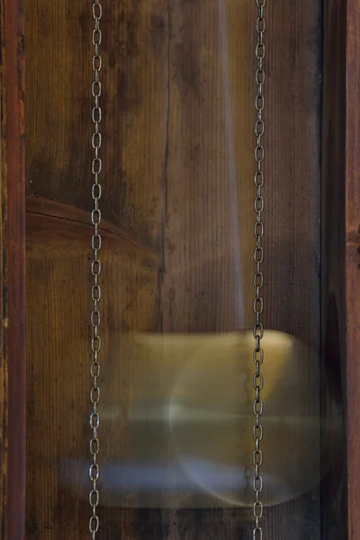Pendulum a grandfather clock — Stock Photo, Image