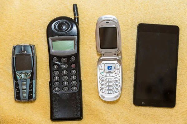 various cell phones - development in mobile technology and communication, optional