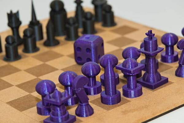 3D printed chess pieces - plastic printing, close-up of a strategic game