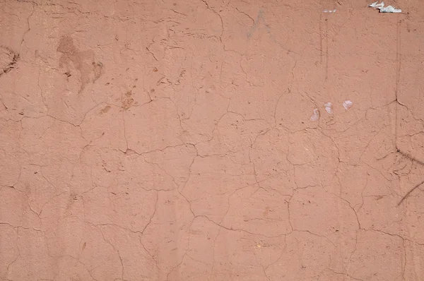 Textura de pared cubierta con pelado de estuco rosa — Foto de Stock