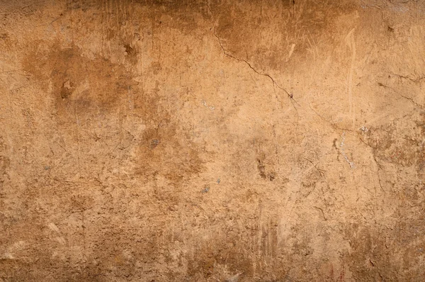 Texture of wall covered cracked plaster yellow — Stock Photo, Image