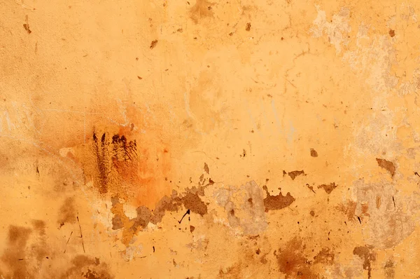 Texture della vecchia parete ricoperta di stucco giallo — Foto Stock