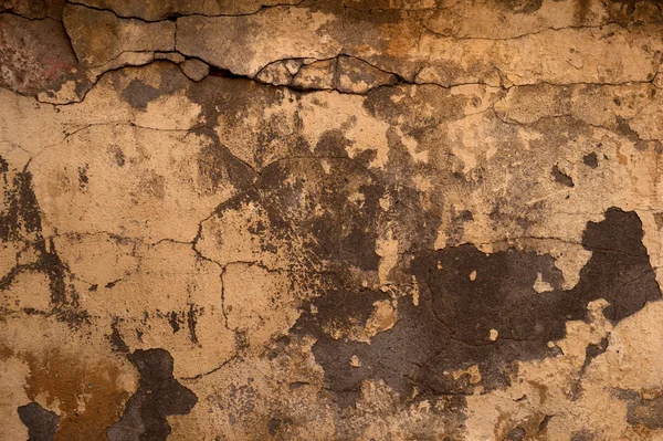 Textura de pared vieja cubierta con estuco amarillo — Foto de Stock