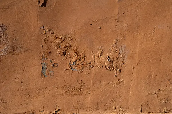 Textura de pared vieja cubierta con estuco amarillo — Foto de Stock