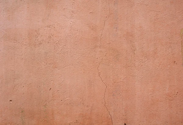 Текстура старой стены покрыта розовой штукатуркой — стоковое фото