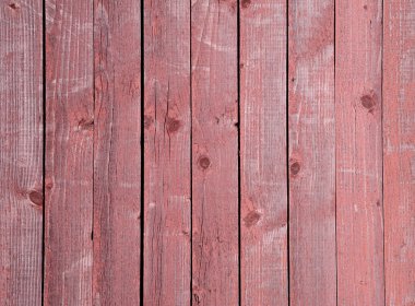 Texture of old wooden fence painted with red paint clipart