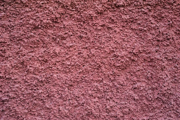 ピンクのスタッコで覆われた古い壁のテクスチャ — ストック写真