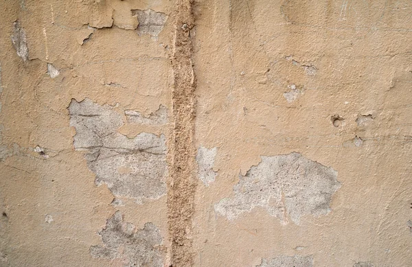 Textura peretelui vechi acoperit cu stuc galben — Fotografie, imagine de stoc