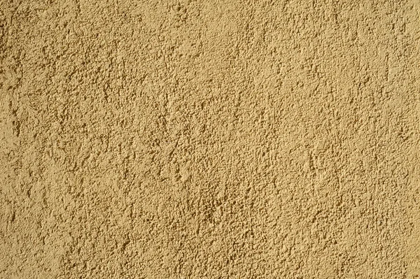 Textura de pared vieja cubierta con estuco amarillo — Foto de Stock