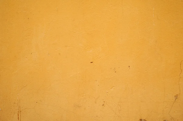 Textura de pared vieja cubierta con estuco amarillo — Foto de Stock