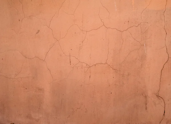 Textura de pared vieja cubierta con estuco naranja — Foto de Stock