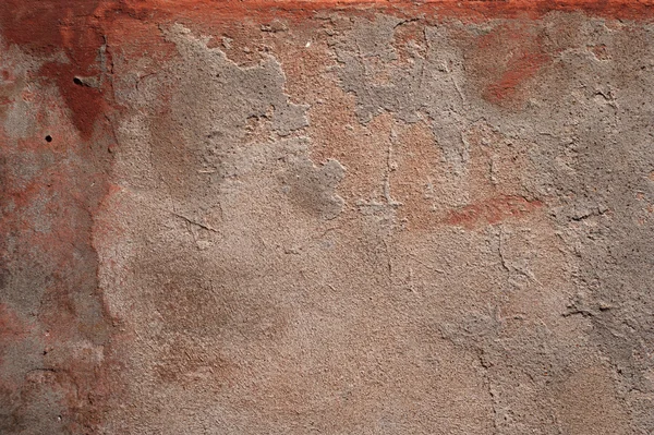 Textur der alten Mauer mit rotem Stuck überzogen — Stockfoto