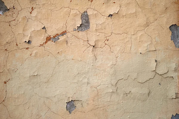 Текстура старой стены покрыта желтой штукатуркой — стоковое фото
