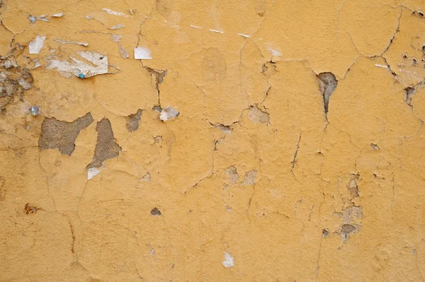 Konsistens av gamla vägg täckt med gula stuckatur — Stockfoto