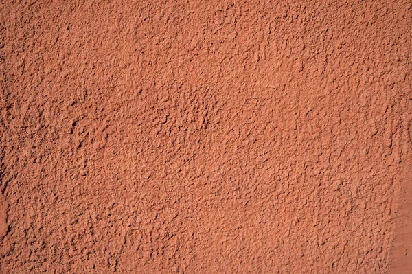 Texture of old wall covered with orange stucco — Stock Photo, Image