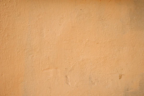 Texture della vecchia parete ricoperta di stucco giallo — Foto Stock