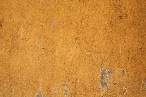 Textury staré zdi pokryté žlutým štuk — Stock fotografie