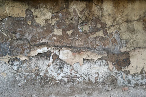 Textur der alten Mauer mit gelbem Stuck überzogen — Stockfoto