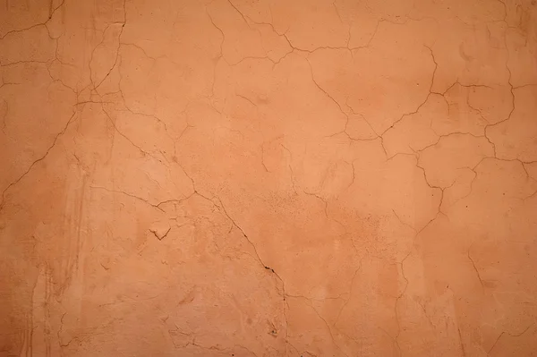 Textura de pared vieja cubierta con estuco naranja — Foto de Stock