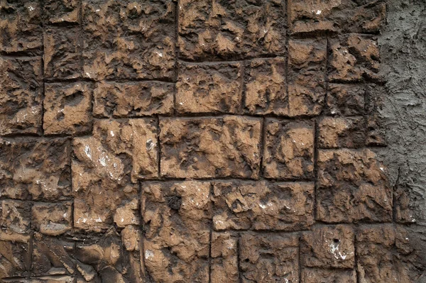 Textura de pared marrón cubierta con yeso decorativo grueso — Foto de Stock