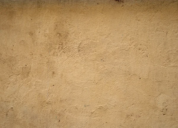 Texture della vecchia parete ricoperta di stucco giallo — Foto Stock