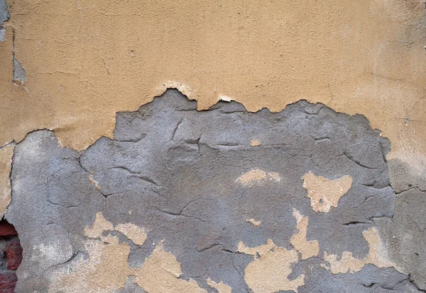 Texture della vecchia parete ricoperta di stucco giallo — Foto Stock