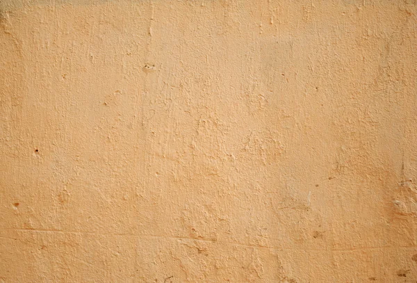 Textura de pared vieja cubierta con estuco amarillo — Foto de Stock