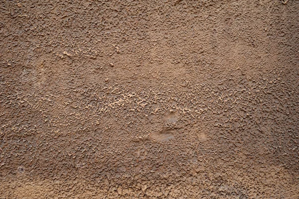 Texture di vecchia parete ricoperta di stucco marrone — Foto Stock