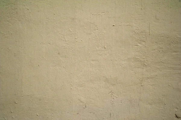 纹理的老墙上长满了黄色的灰泥 — 图库照片