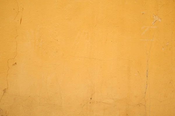 Textura de pared vieja cubierta con estuco amarillo — Foto de Stock