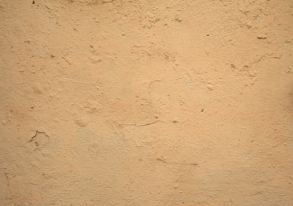 Textura de pared vieja cubierta con estuco amarillo — Foto de Stock