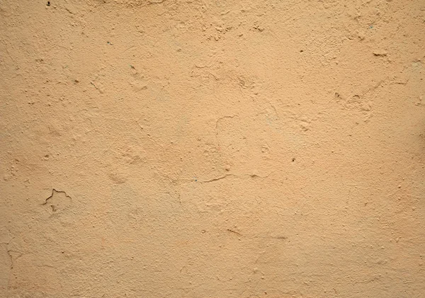 Textur der alten Mauer mit gelbem Stuck überzogen — Stockfoto