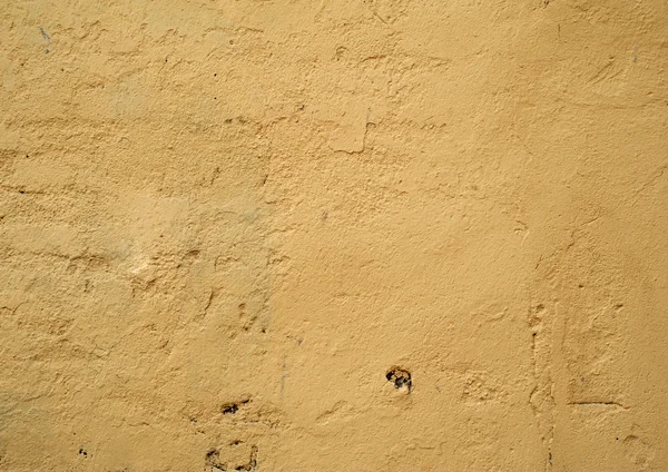 黄色の漆喰で覆われた古い壁のテクスチャ — ストック写真