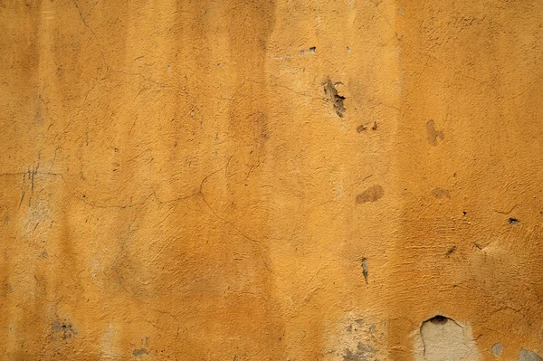 Textura de pared vieja cubierta con estuco amarillo —  Fotos de Stock